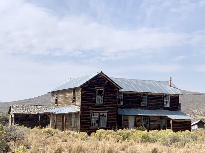 The Shirk Ranch house. The Shirk Ranch house. I imagine all windows had the glass replaced and doors fixed as well. I imagine the inside fixed up well enough to stay in it for a few weeks and write in the room where everyone, family and ranch hands, ate. I picture a wood table and a few chairs.